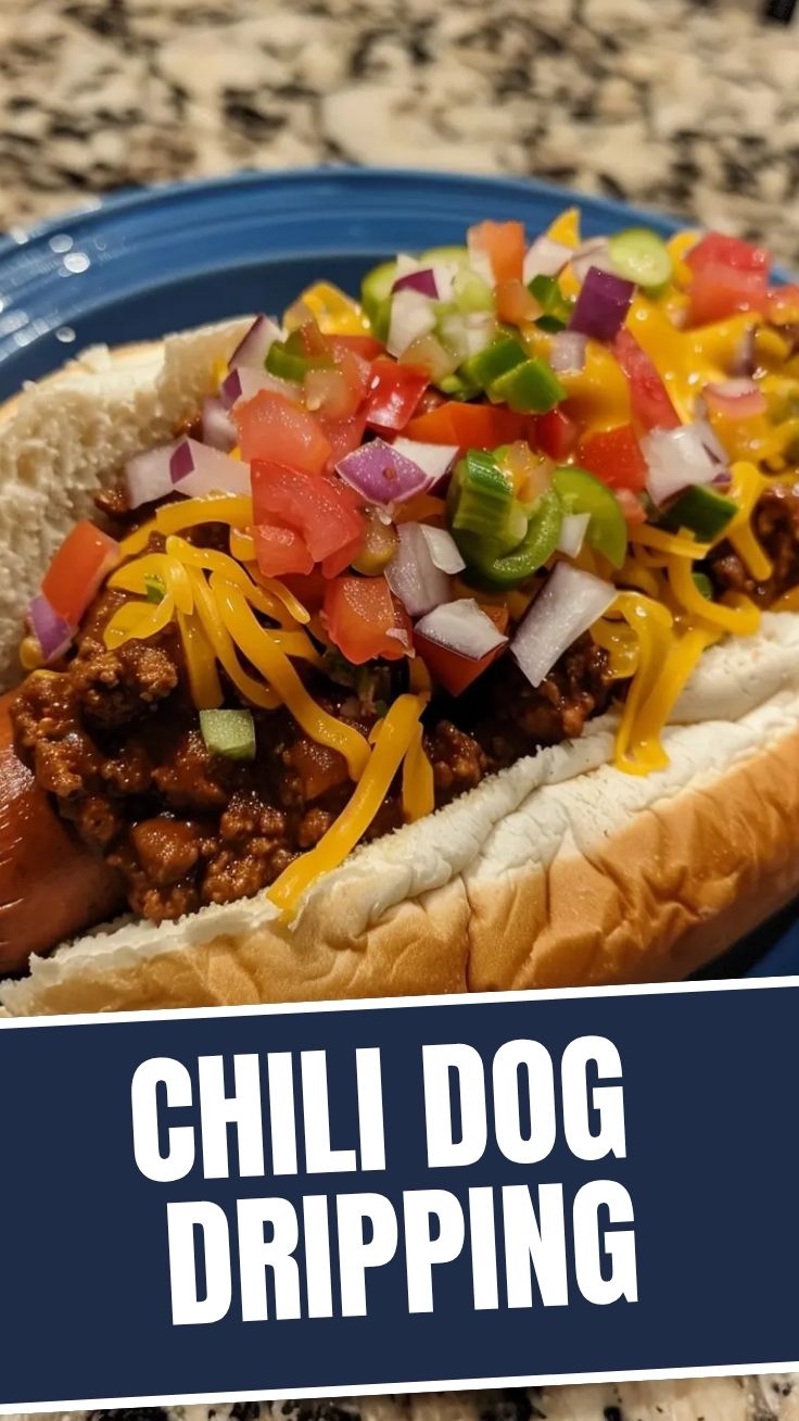 A loaded chili dog with a generous topping of chili and cheese.