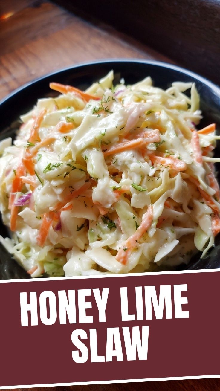 A bowl of fresh creamy coleslaw with shredded cabbage and carrots