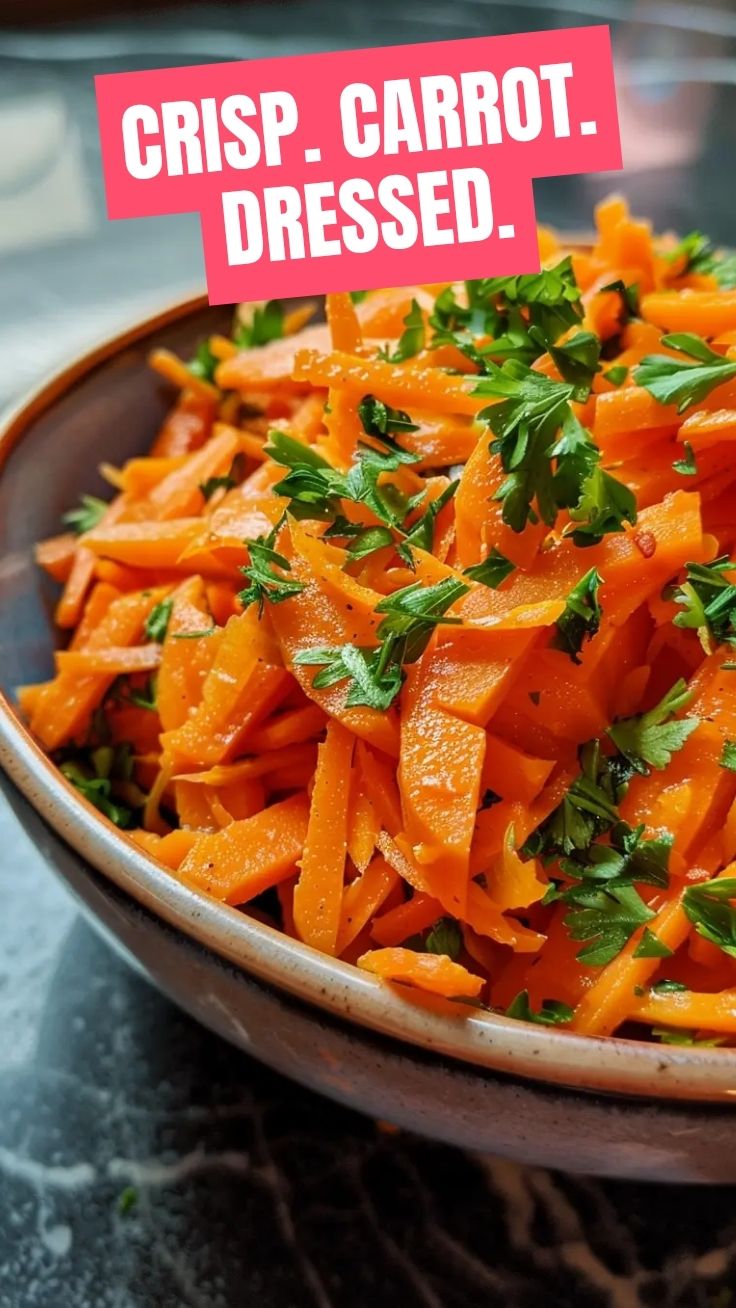 A vibrant bowl of the viral TikTok carrot salad, freshly prepared.