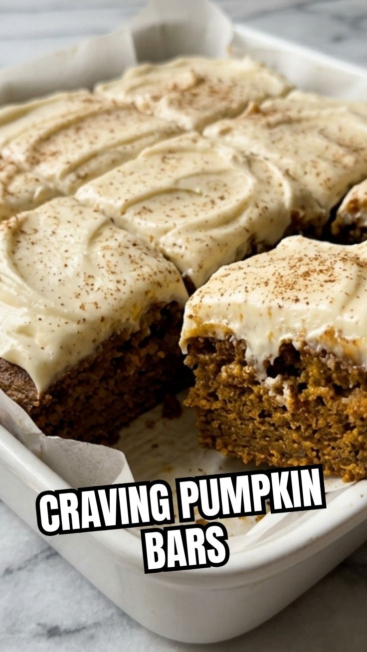 A tray of homemade pumpkin bars cooling on a wire rack.