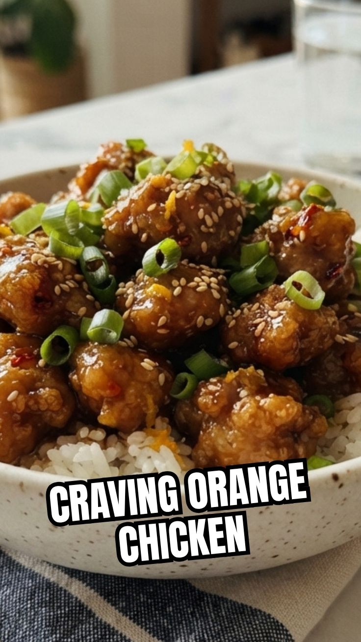 A serving of savory orange chicken garnished with green onions